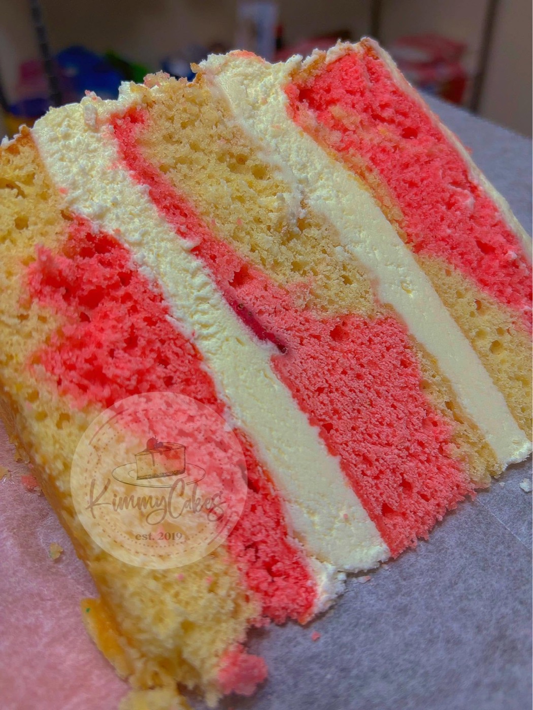 Slice of a tall strawberry layer cake
