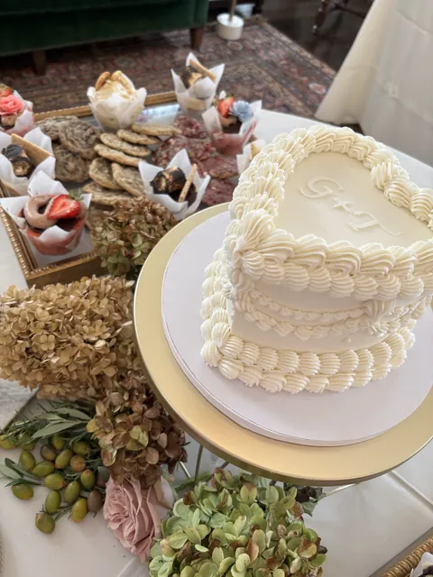 A heart shaped cake piped with a shell border