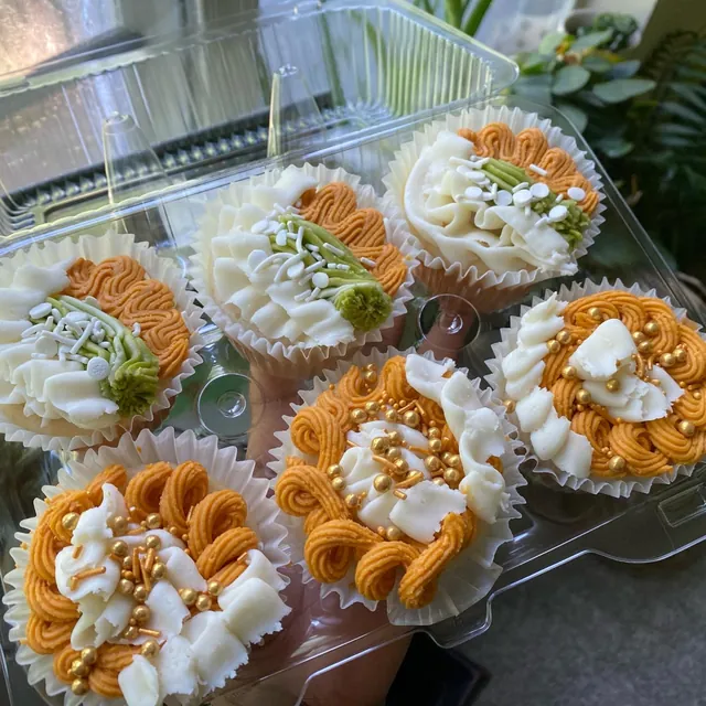 Cupcakes piped in cream and caramel buttercream