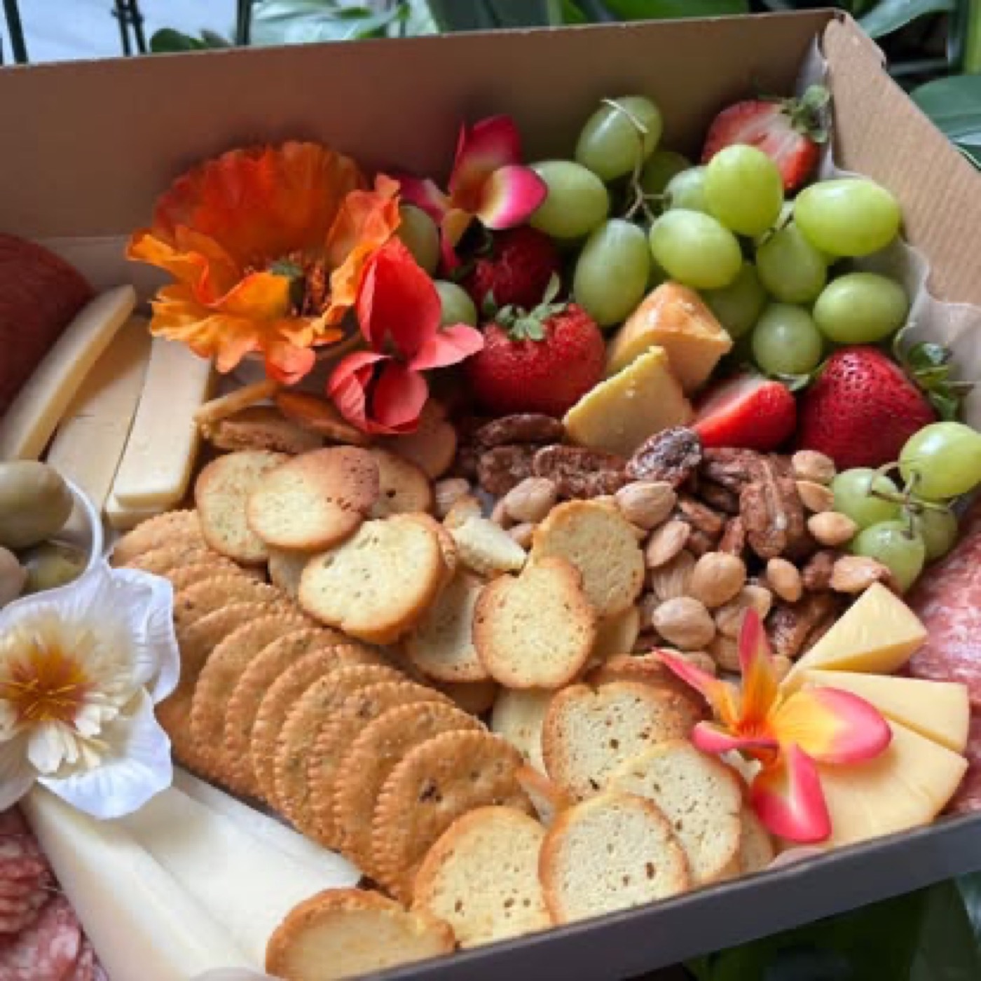 Grazing box with fruit, cheese and crackers