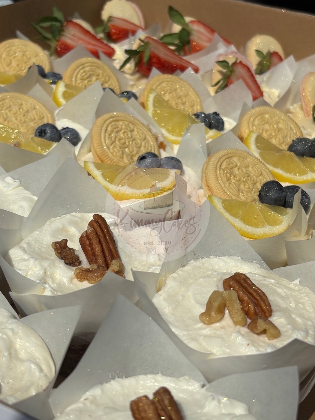 Individual dessert cups topped with lemon and blueberries